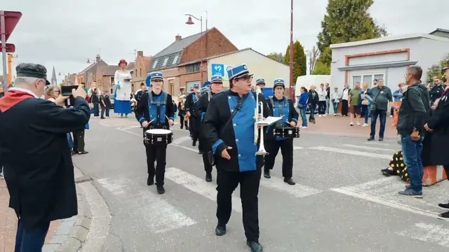 The band parading with the Tiot Batiche giant in Masny.